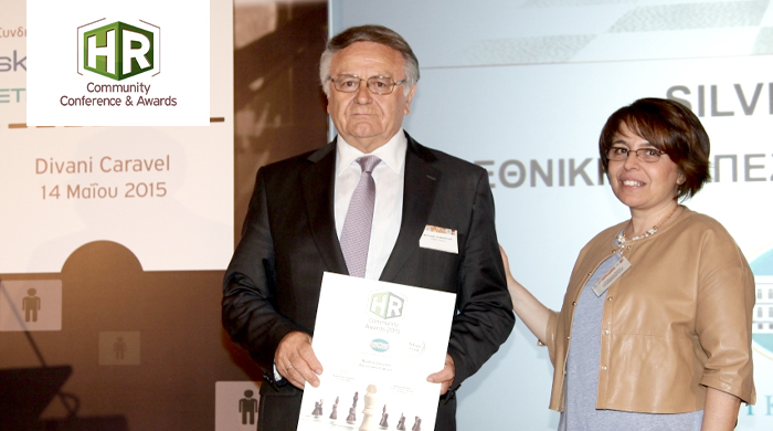 Representatives of NBG S.A. holding an award