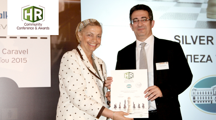 Representatives of NBG S.A. holding an award
